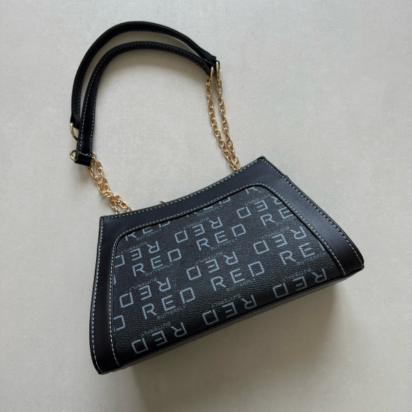 حقيبة لون أسود بنمط أحرف  Monogram patterned black color handbag